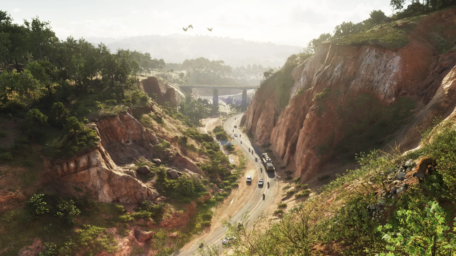 A red-rock canyon in GTA 6's Mount Kalaga National Park with a highway and bridge winding through it.