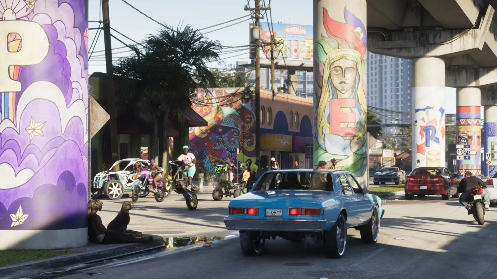 Klasyczny muscle car na pokrytej muralami ulicy Vice City w GTA 6.